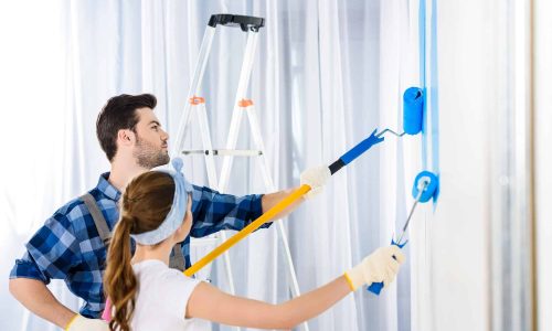boyfriend-and-girlfriend-painting-wall-with-blue-paint.jpg